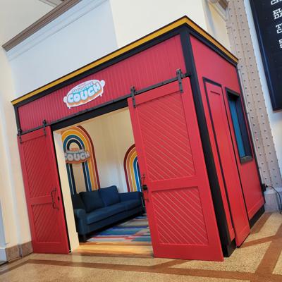 A red booth with sliding barn doors